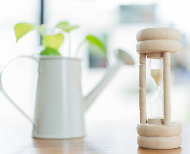 istock Hourglass with tree mug shallow depth of field 499449666