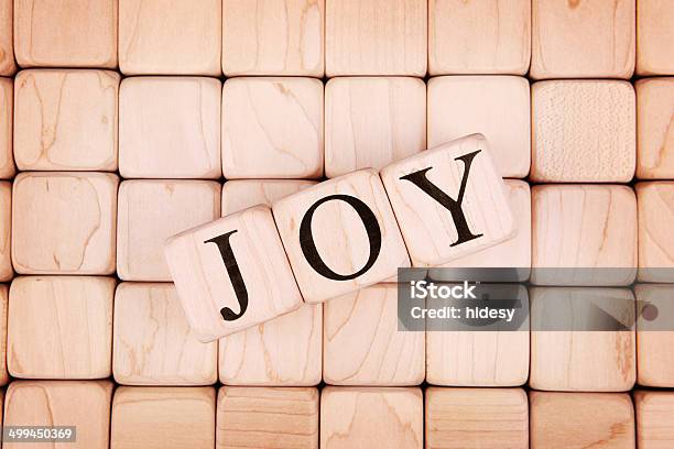 Joy Spelled Out In Blocks On Top Of Other Blocks Stock Photo - Download Image Now - Alphabet, Block Shape, Capital Letter