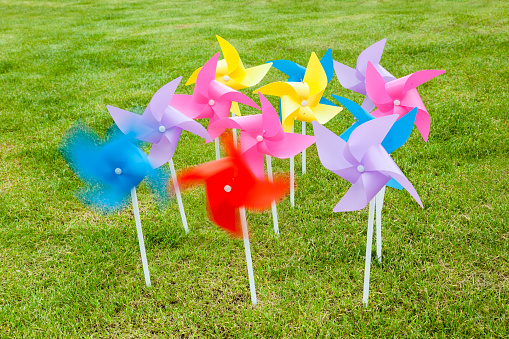 pinwheel toys in lawn background