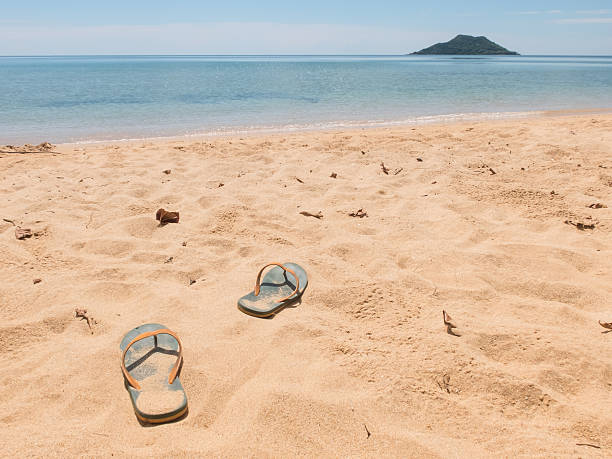 istock Sandle walking on the bach with island and sea background 499450968