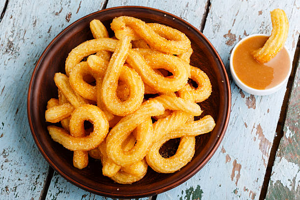istock churros sweet dessert with caramel 499452183