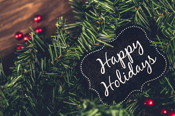 istock Christmas evergreen garland and Happy Holidays message 499452682