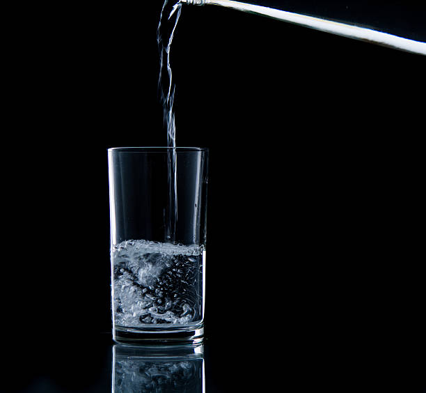 istock Pouring water on glass 499452745