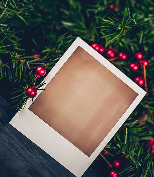 Christmas evergreen garland with blank photo frame for Christmas Card Christmas evergreen garland with blank photo frame for Christmas Card christmas card photos stock pictures, royalty-free photos & images