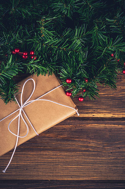 istock Rustic Christmas gift with evergreen garland 499453160