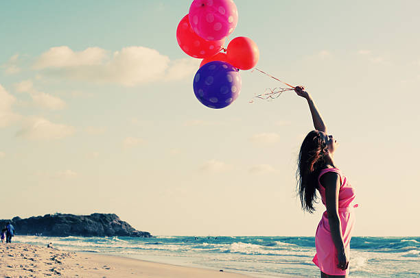 istock beautiful woman on seaside 499453535
