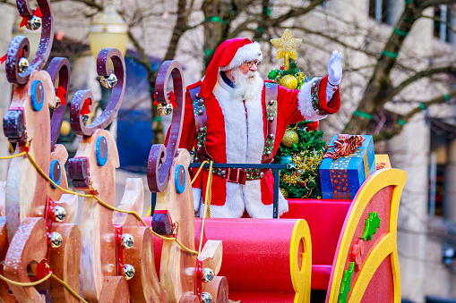 Portland, Oregon, USA - November 27, 2015: Costumed Santa Claus on Sledge march in the annual My Macy's holiday Parade across Portland Downtown.