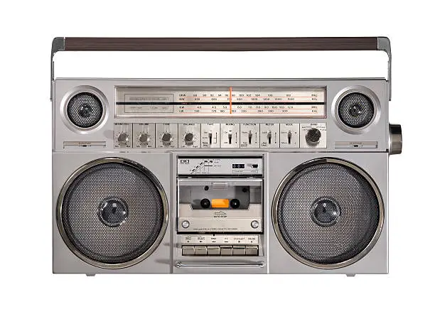 Studioshot of an oldschool boombox isolated in front of white background.