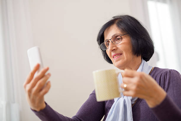 istock Senior Woman Using Smart Phone 499459476