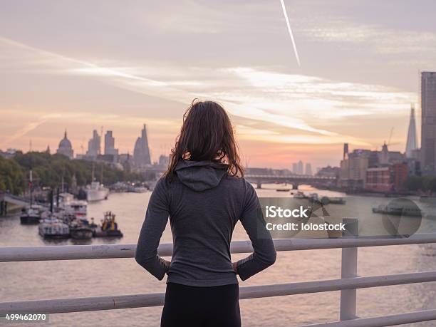 Young Woman Wearing Hoodie On Bridge In London At Sunrise Stock Photo - Download Image Now