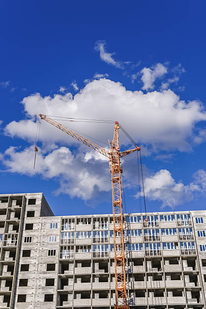 istock Building multistorey houses and construction machinery 499462238
