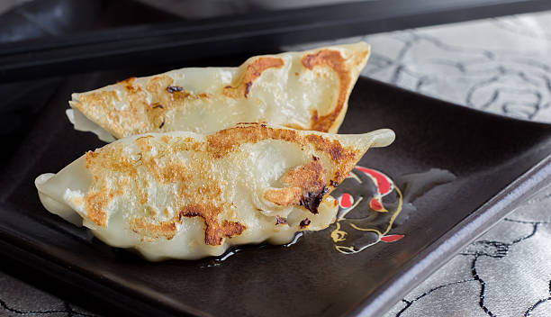 istock Japanese gyoza on a black plate 499466201