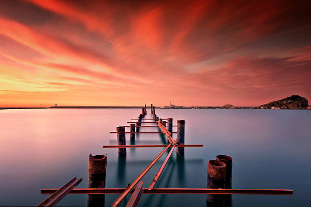 Pier and sunset  long exposure Turkey Turkey long exposure and pier  orange county new york stock pictures, royalty-free photos & images