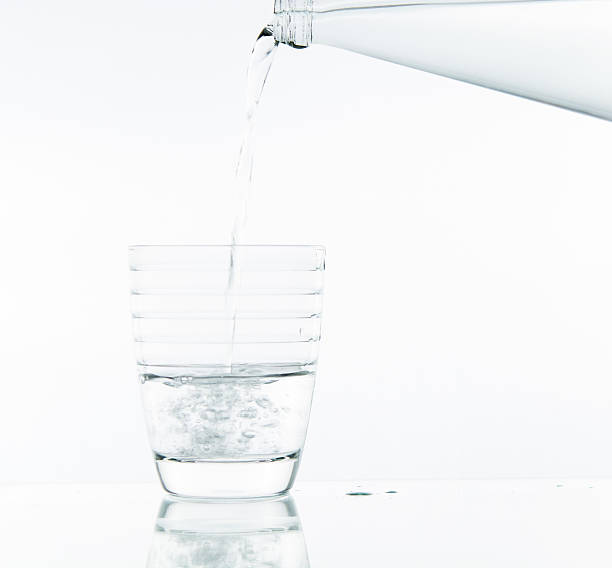 istock Pouring water on glass 499466645