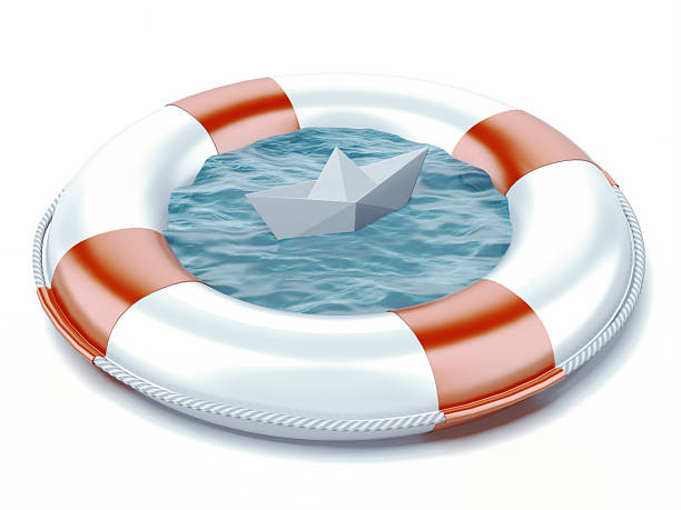 istock paper boat in lifebuoy 499467341