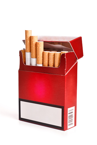 Pack of cigarettes with cigarettes sticking out isolated on white