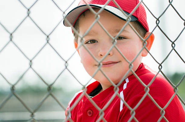 istock Baseball player wearing uniform sitting in dugout 499467761