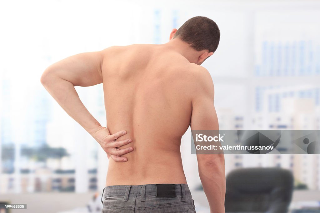 Dolor de espalda - Foto de stock de Adulto libre de derechos