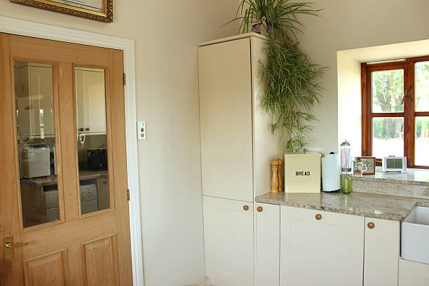 istock Image of country kitchen, Shaker cabinets, cream doors, pine door 499470377