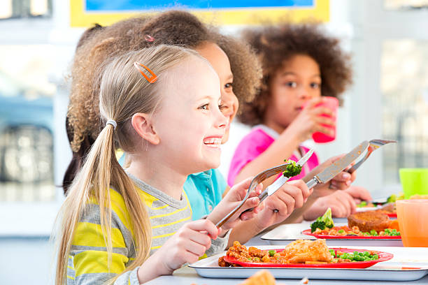 istock Children Eating School Dinners 499470909