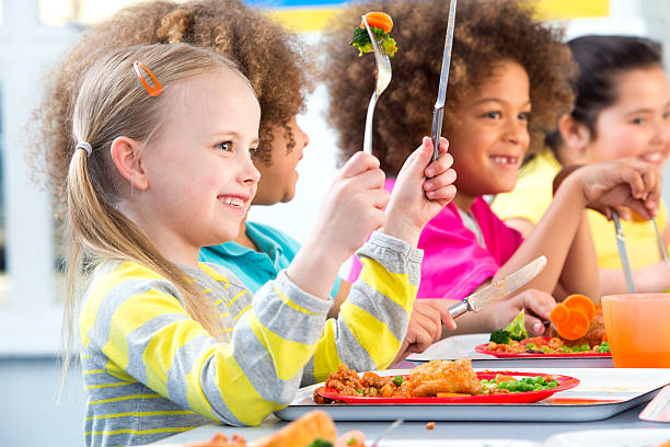 istock Children Eating School Dinners 499470911