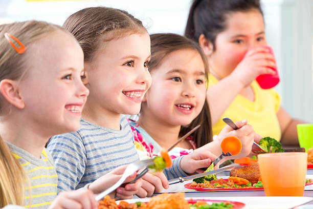 istock Children Eating School Dinners 499470913