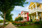 istock Row of colorful garden homes in suburban area 499471139