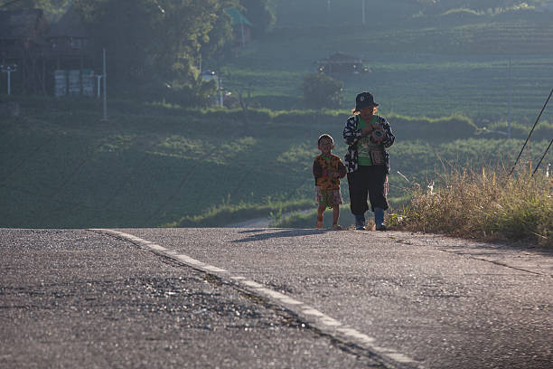 Mother and son were walking home after work. stock photo