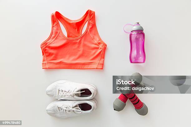 Close Up Of Sportswear Dumbbells And Bottle Stock Photo - Download Image Now - Gym, Clothing, Sport