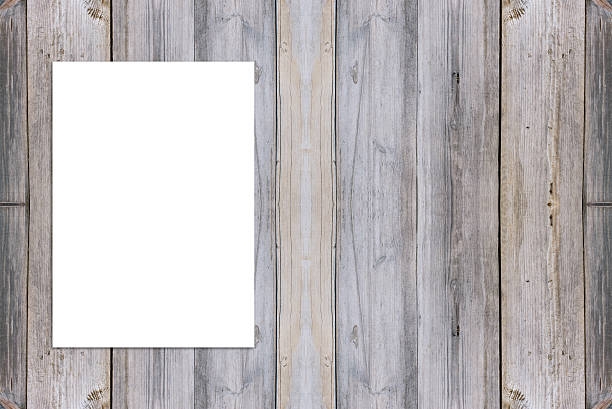istock Blank folded paper poster hanging on wooden wall. 499480572