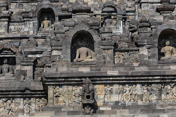 istock Stoned image of Buddha in Borobudur, Indonesia 499482346