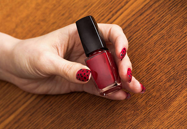 Female Hand With Red Manicure Holding Bottle Of Nail Polish Stock Photo - Download Image Now - iStock Female Hand With Red Manicure Holding Bottle Of Nail Polish Stock Photo - Download Image Now - iStock