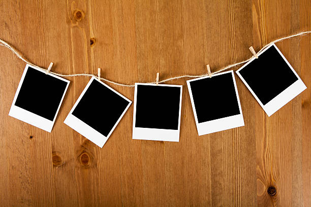 istock Blank photos hanging on clothesline 499487242