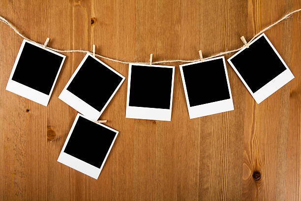 istock Blank photos hanging on clothesline 499487378