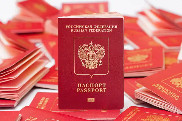 Russian international passport is used in travels, top view. International passport has inscription on english and include high security features, such as biometric data.