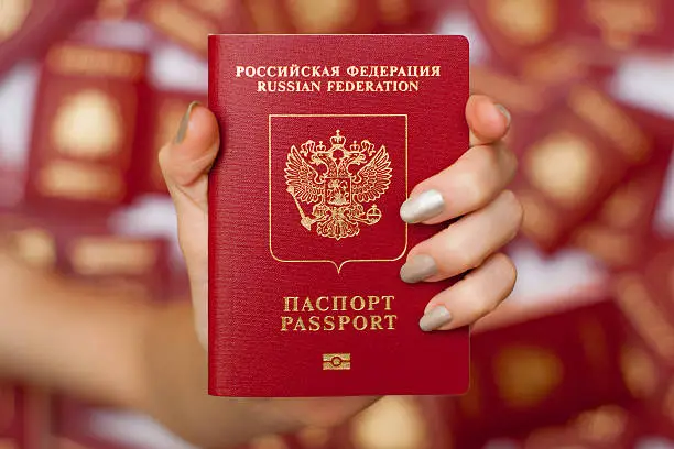 Russian international passport is used in travels, top view. International passport has inscription on english and include high security features, such as biometric data.