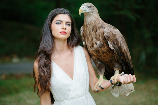 Beautiful girl and her eagle