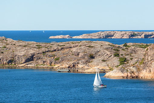 Rocky archipelago with a sailing boat