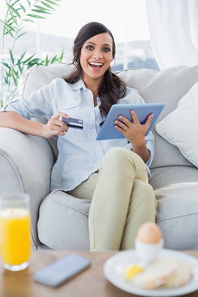 istock Cheerful gorgeous brunette buying online having breakfast 499493809