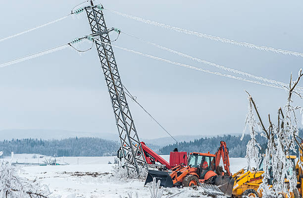 istock Icy Power Pole Falling and people repairing 499506308