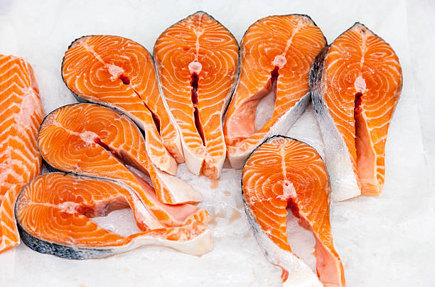 istock Raw red fish is sliced, ready for sale 499509520