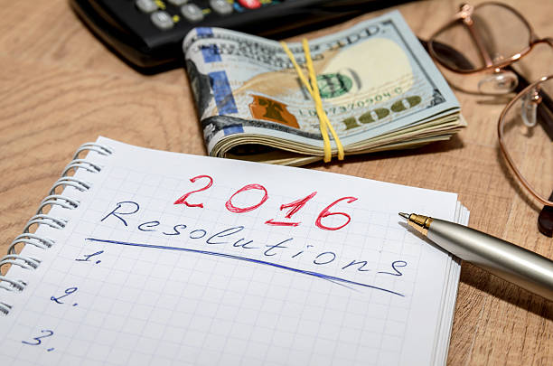 istock GOALS for 2016 message with 100 US dollars and pen 499509702