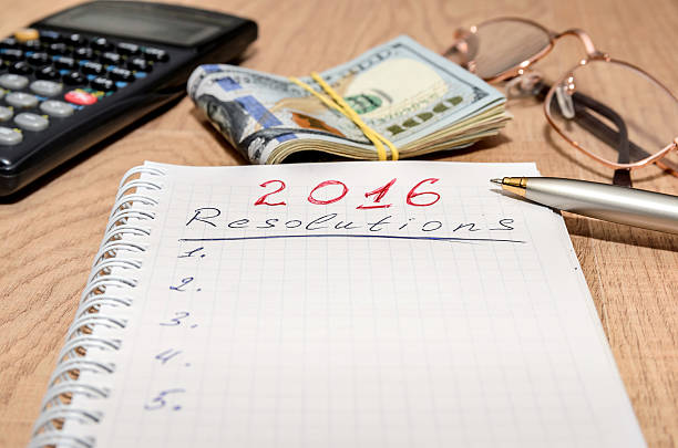 istock GOALS for 2016 message with 100 US dollars and pen 499509822