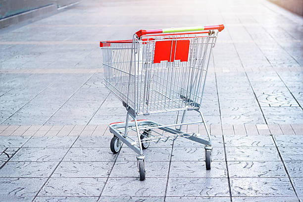 istock Empty shopping cart on the floor background 499510516