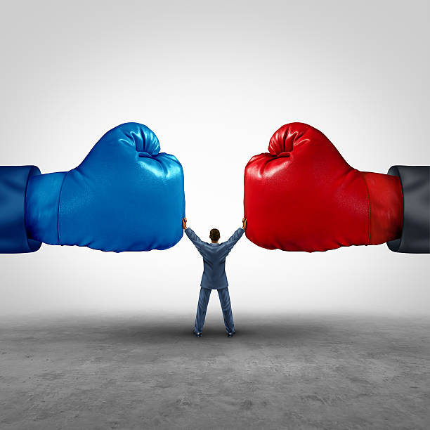 Mediate And Legal Mediation Mediate and legal mediation business concept as a businessman or person separating two boxing glove opposing competitors as an arbitration success symbol for finding common interests to lawfully solve a conflict. mediation photos stock pictures, royalty-free photos & images