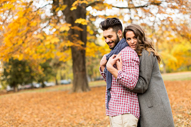 istock Young couple in the autumn park 499510962