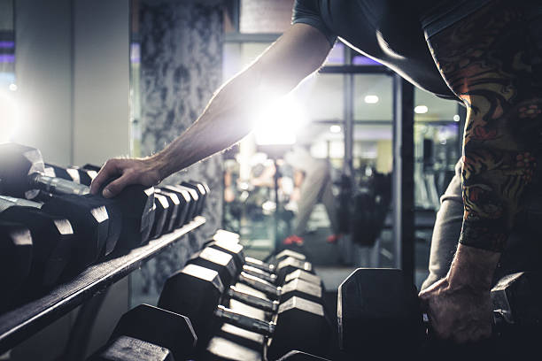 istock Healty Man Exercising with Arm Weights 499511634