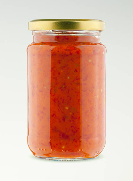 istock Glass jar isolated studio shot - ajvar 499511760