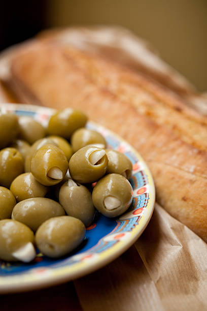 istock Green olives tapas and baguette 499511962