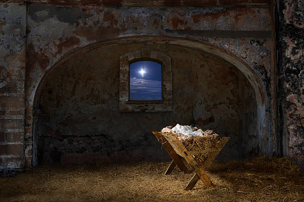 Manger in Old Barn Empty manger in old barn with window showing the Christmas star nativity scene photos stock pictures, royalty-free photos & images